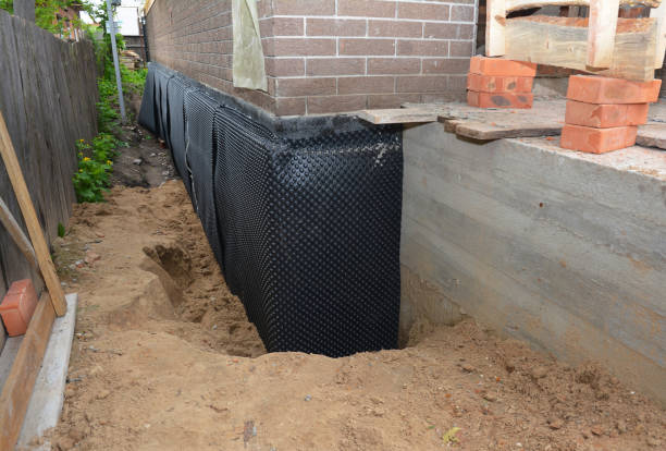 Happy homeowners after waterproofing job in Saint Mary Of The Woods